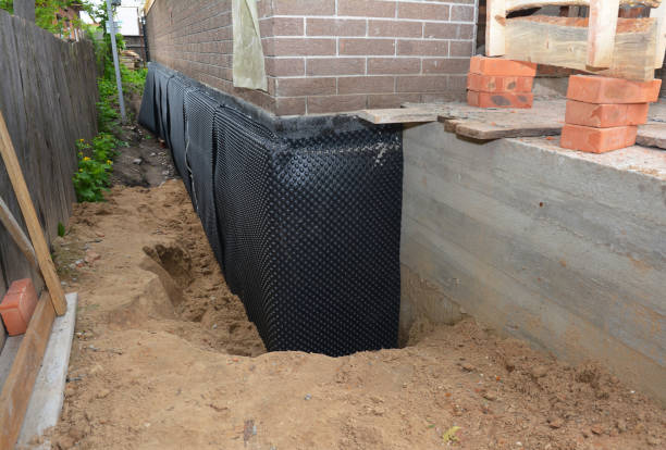 Happy homeowners after waterproofing job in Neosho